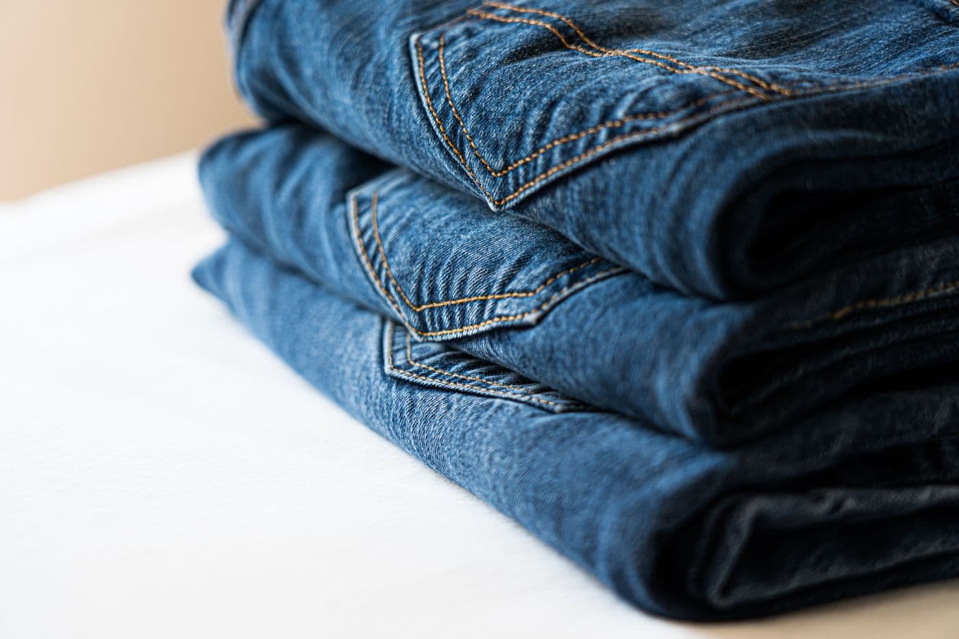 Stack of folded blue jeans