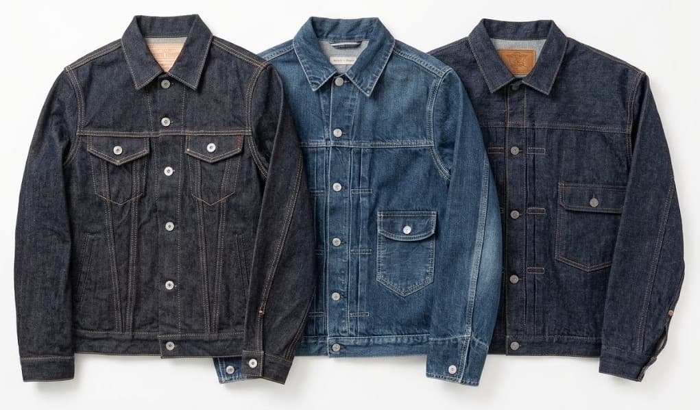 Three denim jackets in dark indigo and medium blue washes