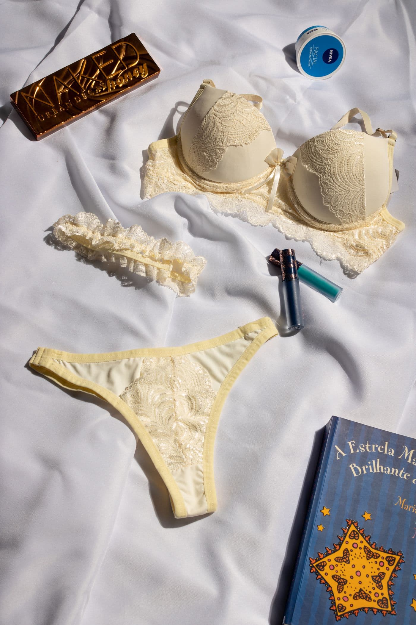 Cream lingerie set laid out on fabric