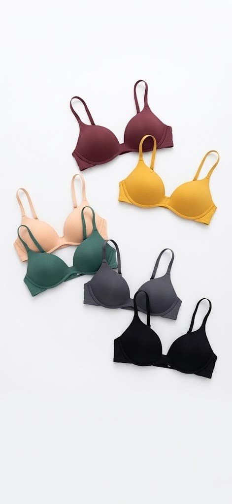 Smooth molded-cup bras in burgundy, mustard, beige, green, grey and black