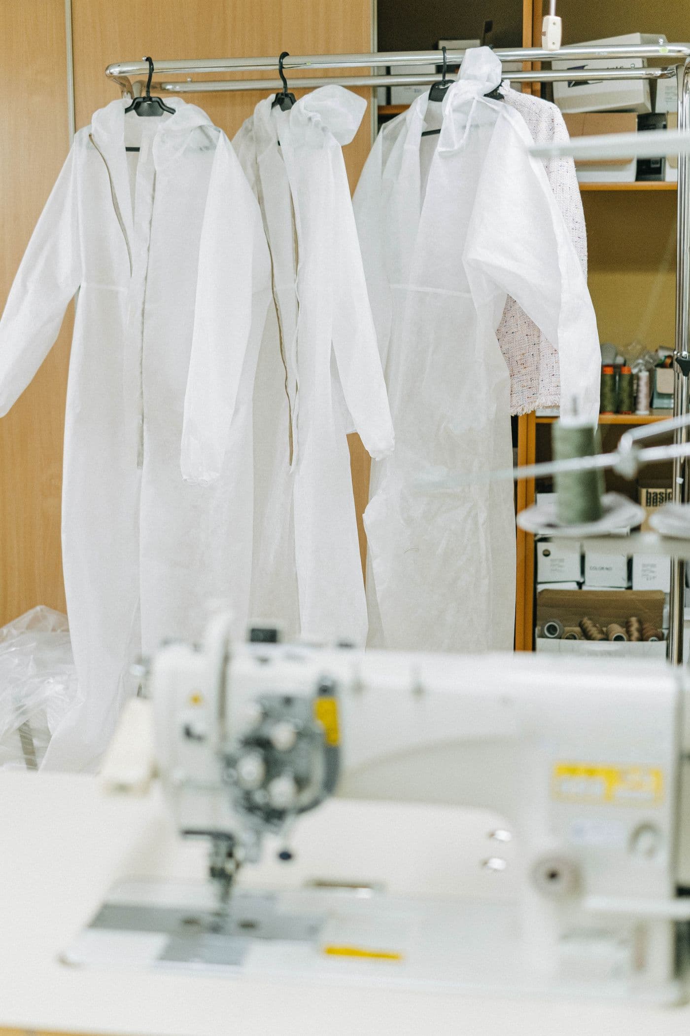 White work coats hanging on a rail