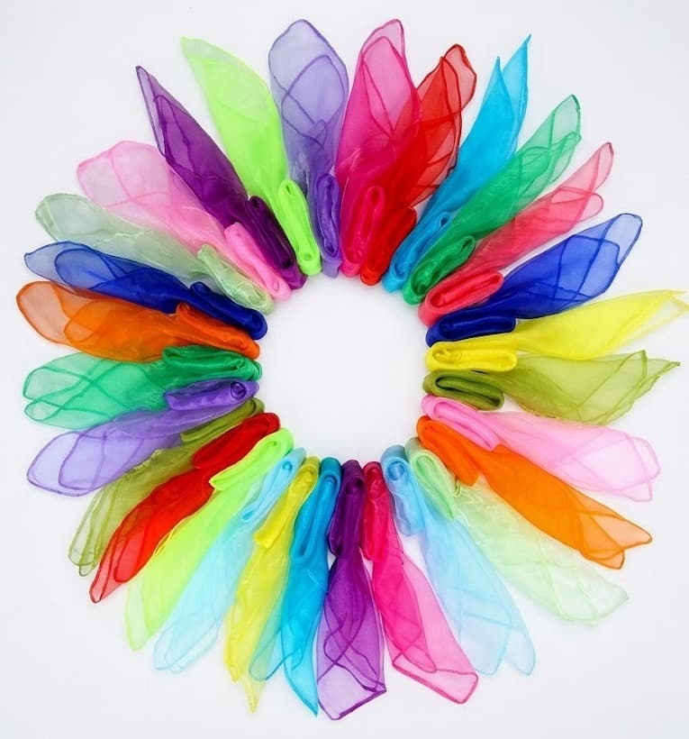 Rainbow-colored sheer organza scarves arranged in a circle