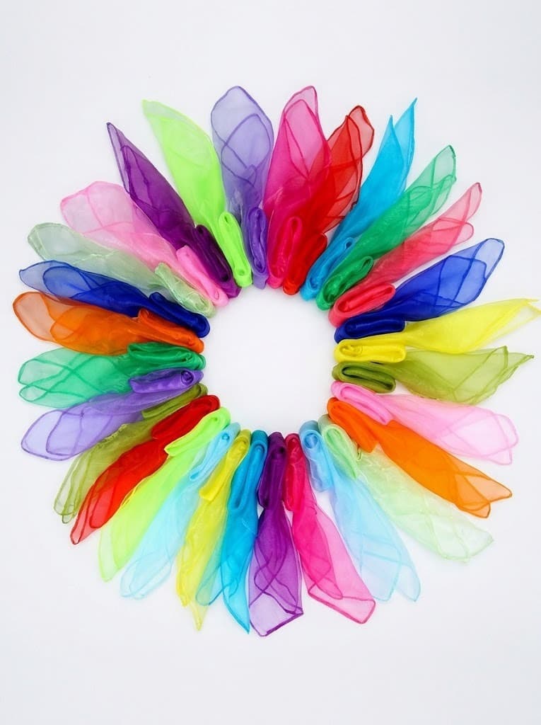 Rainbow-colored sheer organza scarves arranged in a circle