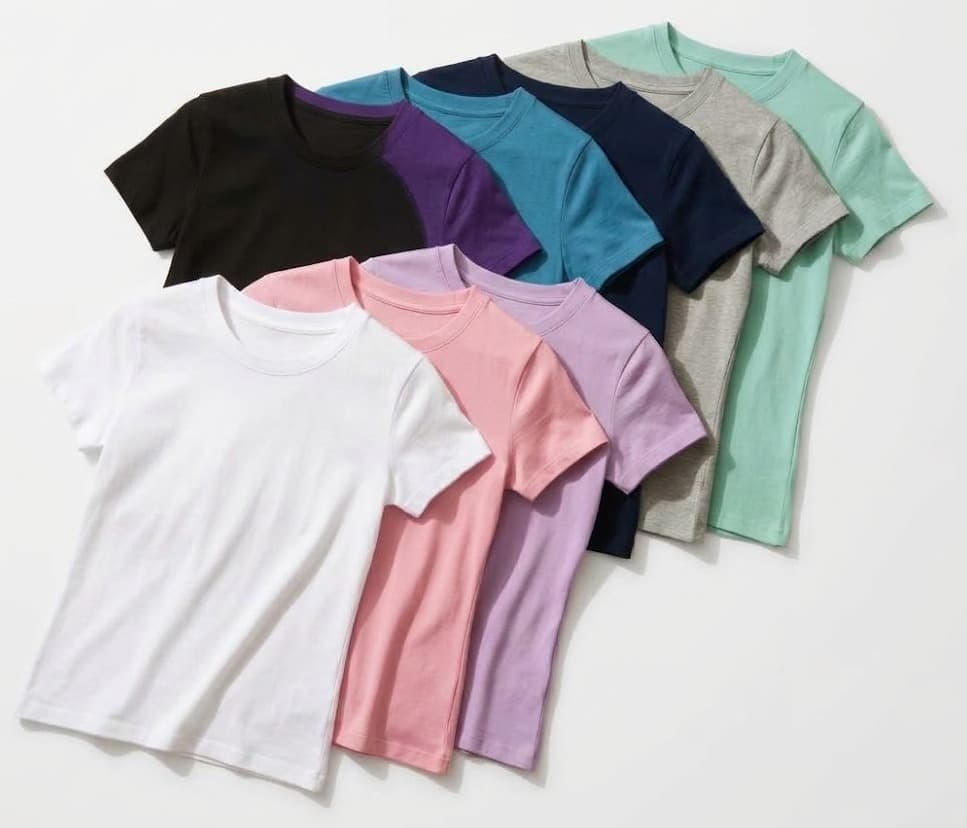 Assorted women's t-shirts in white, pink, lilac, navy, teal and mint