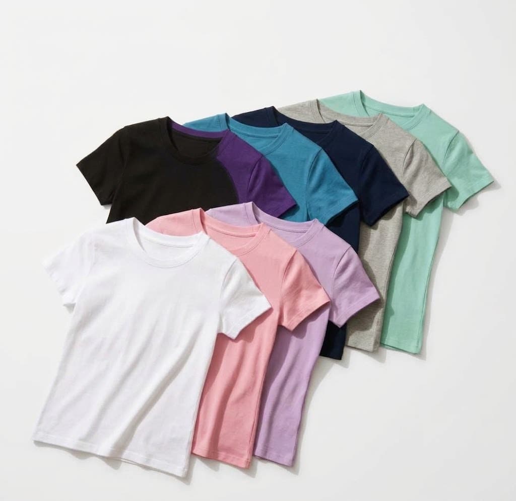 Assorted women's t-shirts in white, pink, lilac, navy, teal and mint